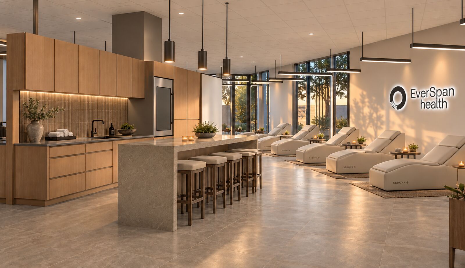 Architect's rendering of the EverSpan Health lounge: recovery loungers by tall windows, a wood kitchen bar, and the EverSpan Health sign on the wall.